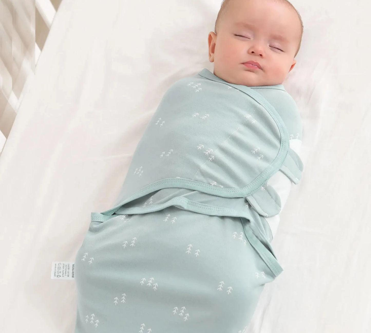 Featuring Newborn Sleep Swaddle in Rainbow