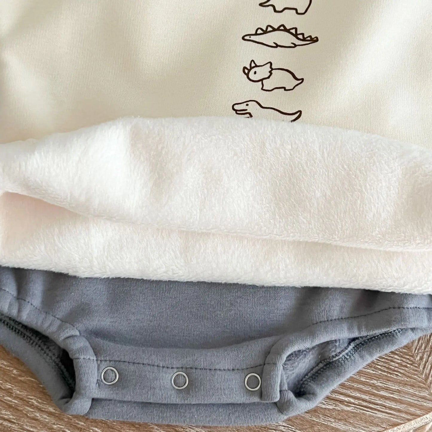 Baby Dinos Sweatshirt Bodysuit in Apricot